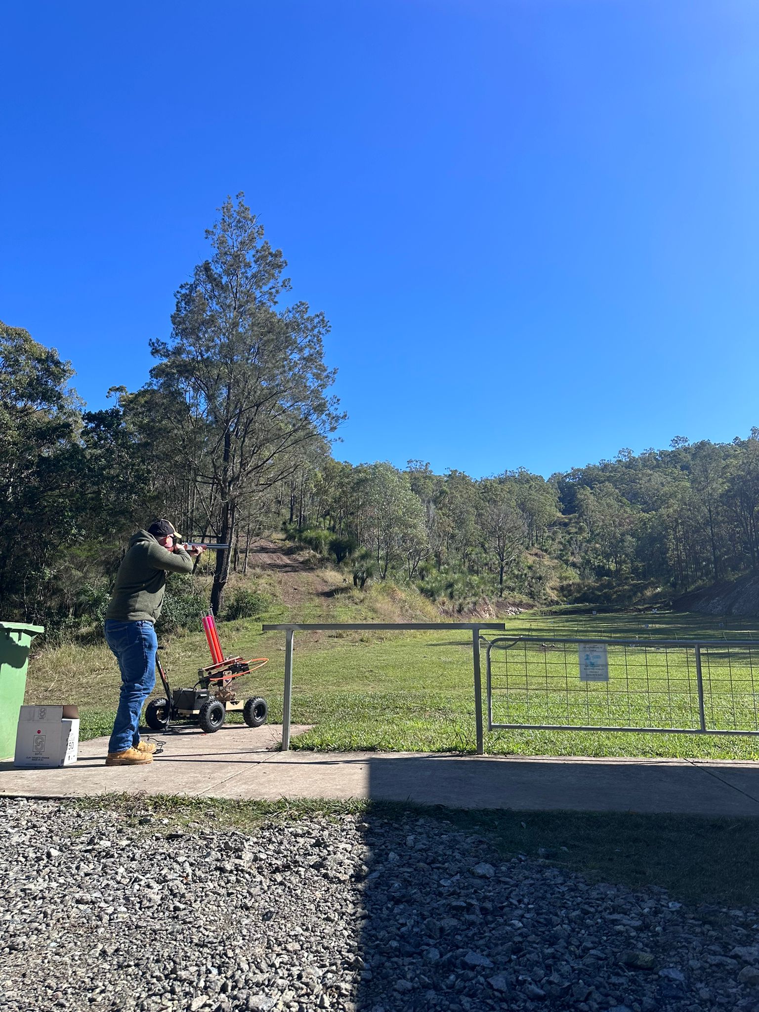 View down the 300-metre range with a shooter at the bench, Wattle Grove Park