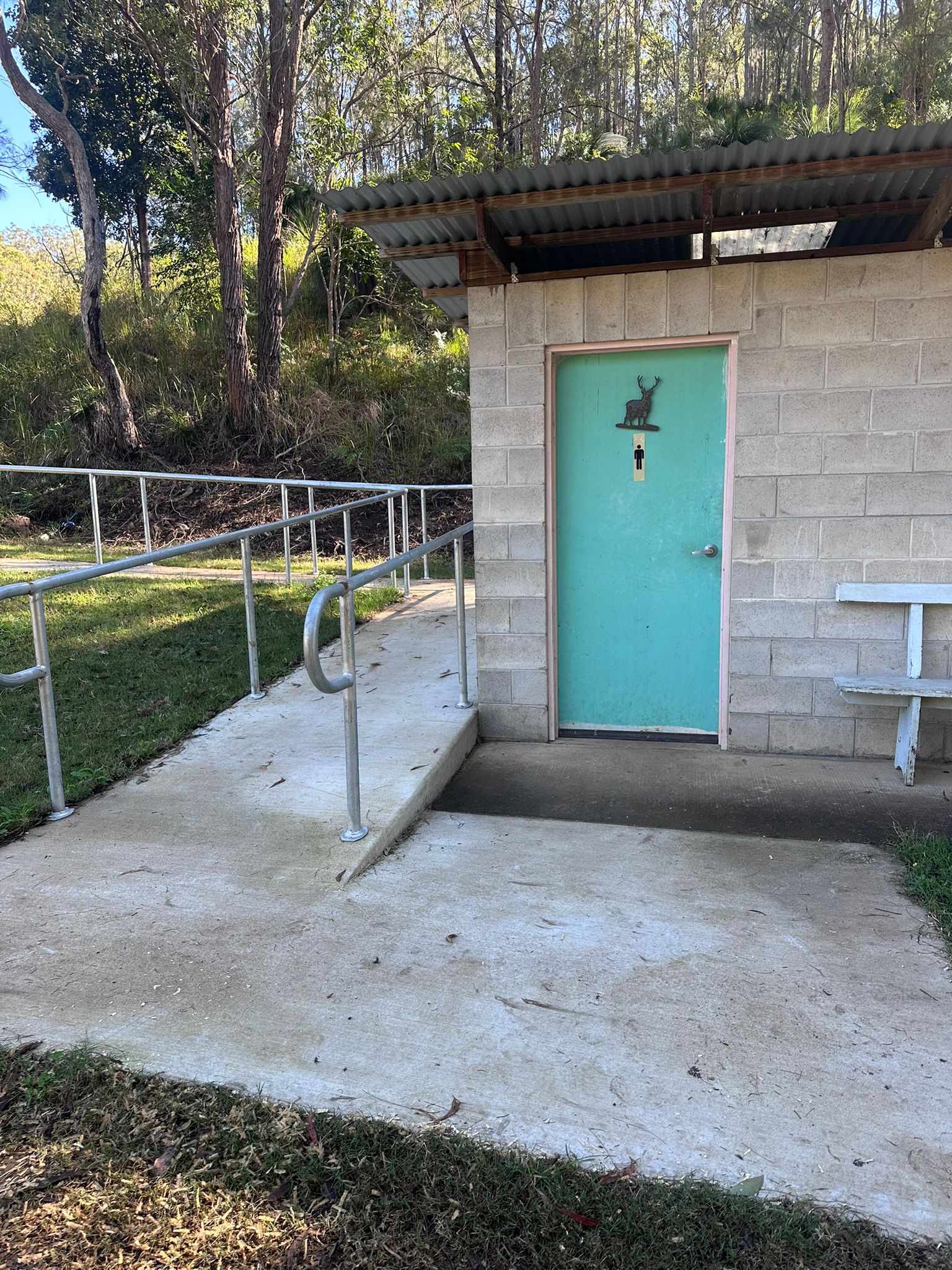 On-site amenities block with concrete pathway at Wattle Grove Park