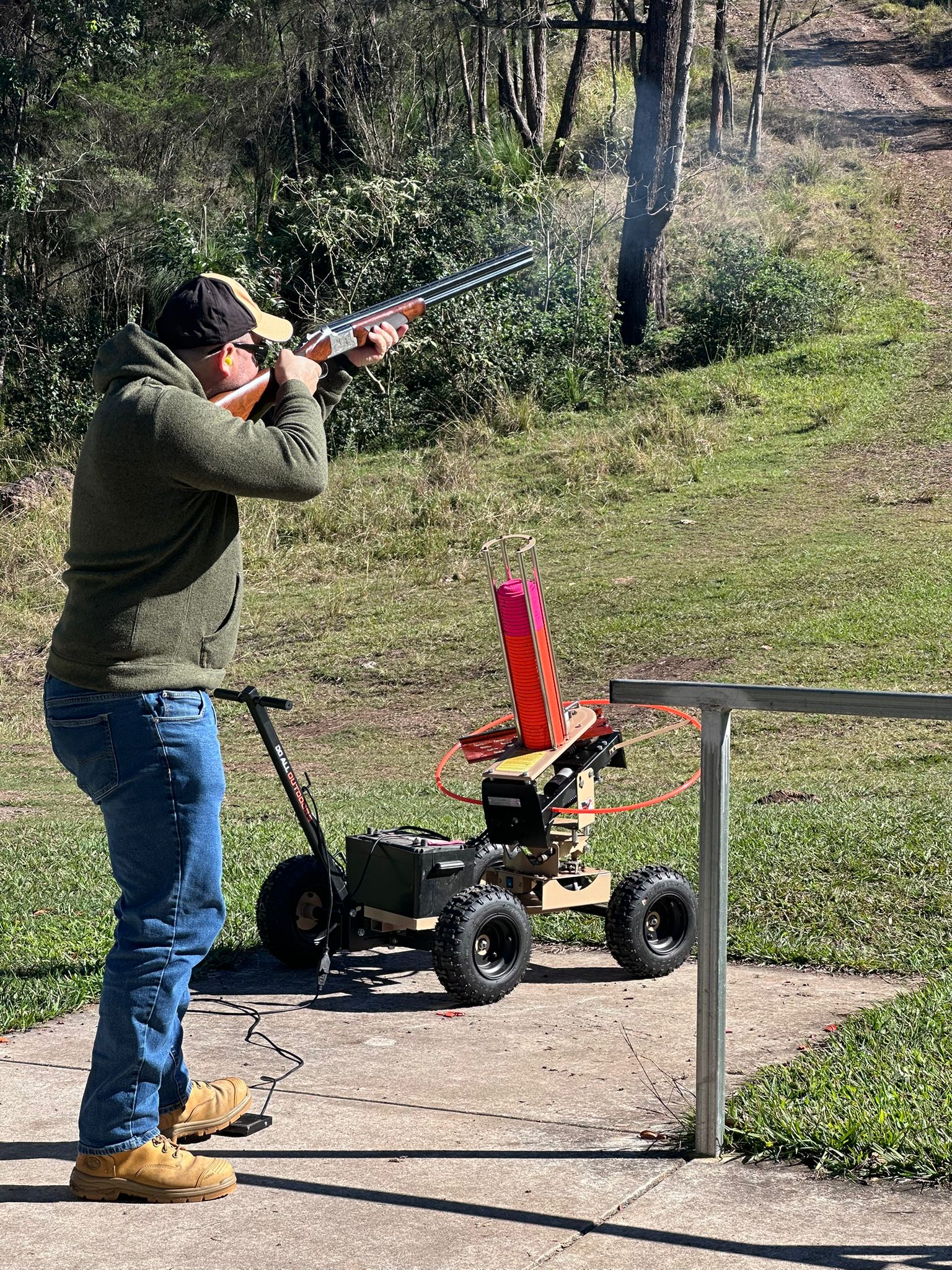 Shooter taking aim with a rifle on the firing line at Wattle Grove Park
